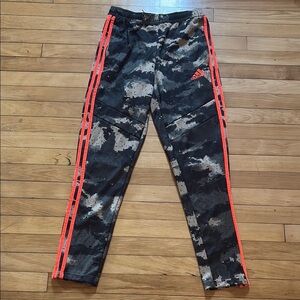 Adidas Camo Pants with Neon Orange accents. Boys size large